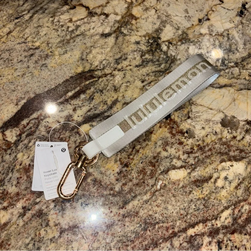 Lululemon Never Lost Keychain Vapor Gold Brand New NWT - Picture 3 of 5